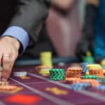 Man placing a bet at the casino